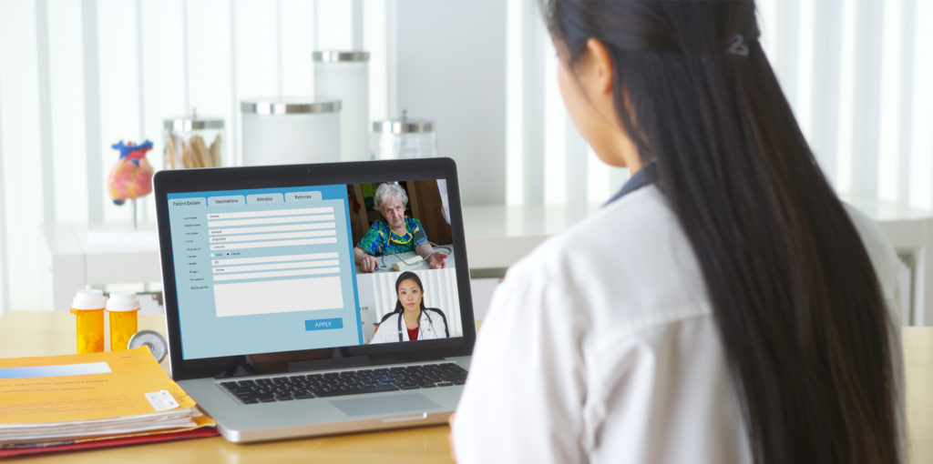 Doctor diagnosing a patient over Vidyo