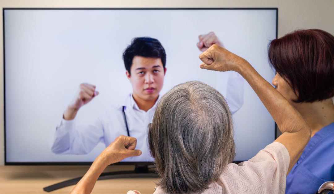 Elderly woman receiving physical therapy on a video call