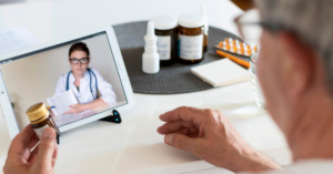 Man using telehealth services to remotely access healthcare via tablet