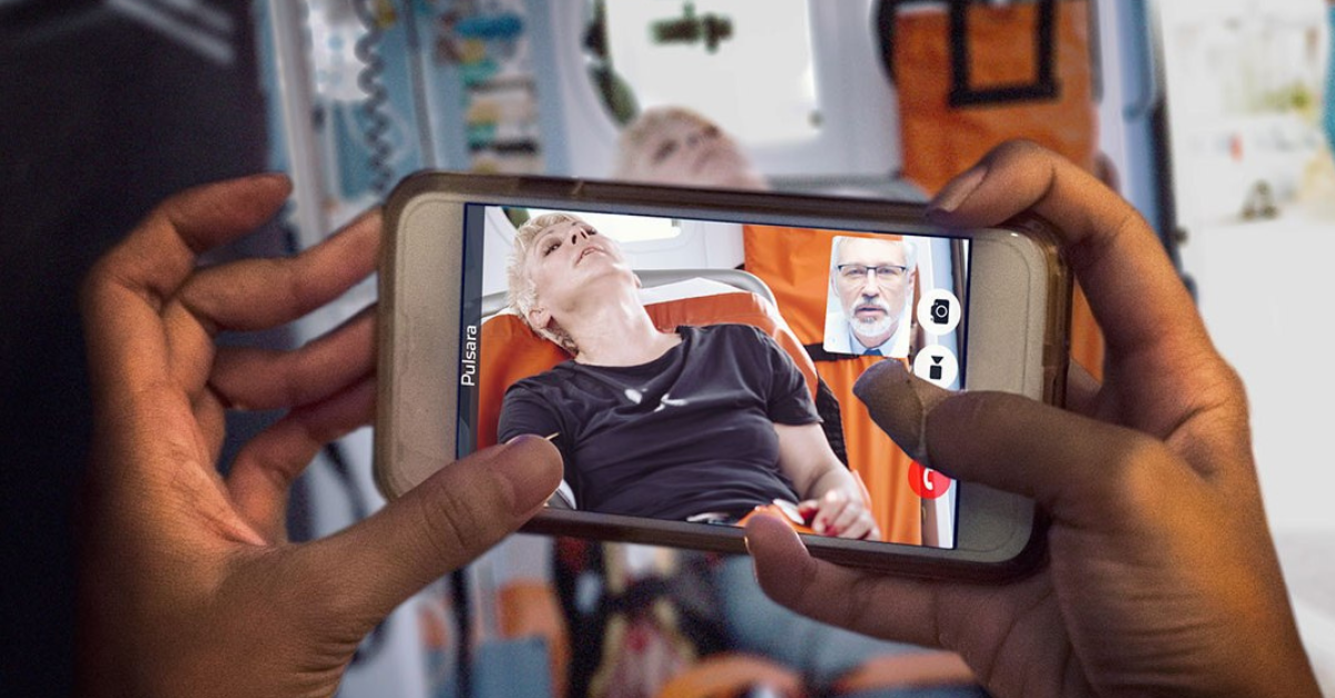 first responder holding a phone showing patient condition
