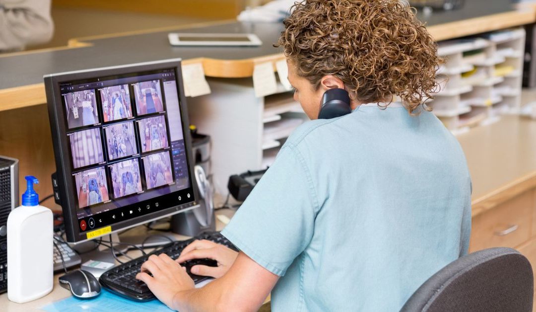 Healthcare provider observing multiple patients using a telesitter solution