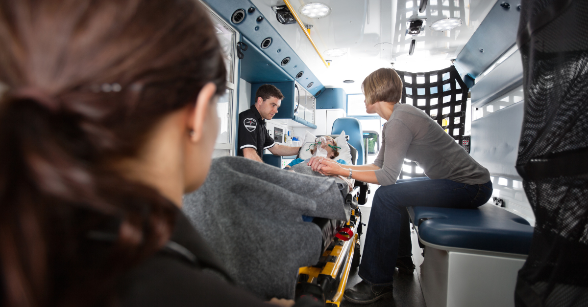 First responder in an ambulance with patient