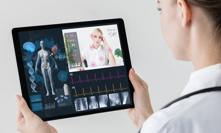 Doctor remote patient monitoring patient through tablet