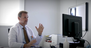 Doctor utilizing virtual care platform from his desktop computer