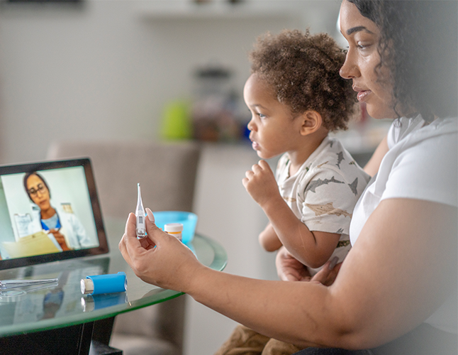 mom and her baby is seeing doctor with virtual care platform